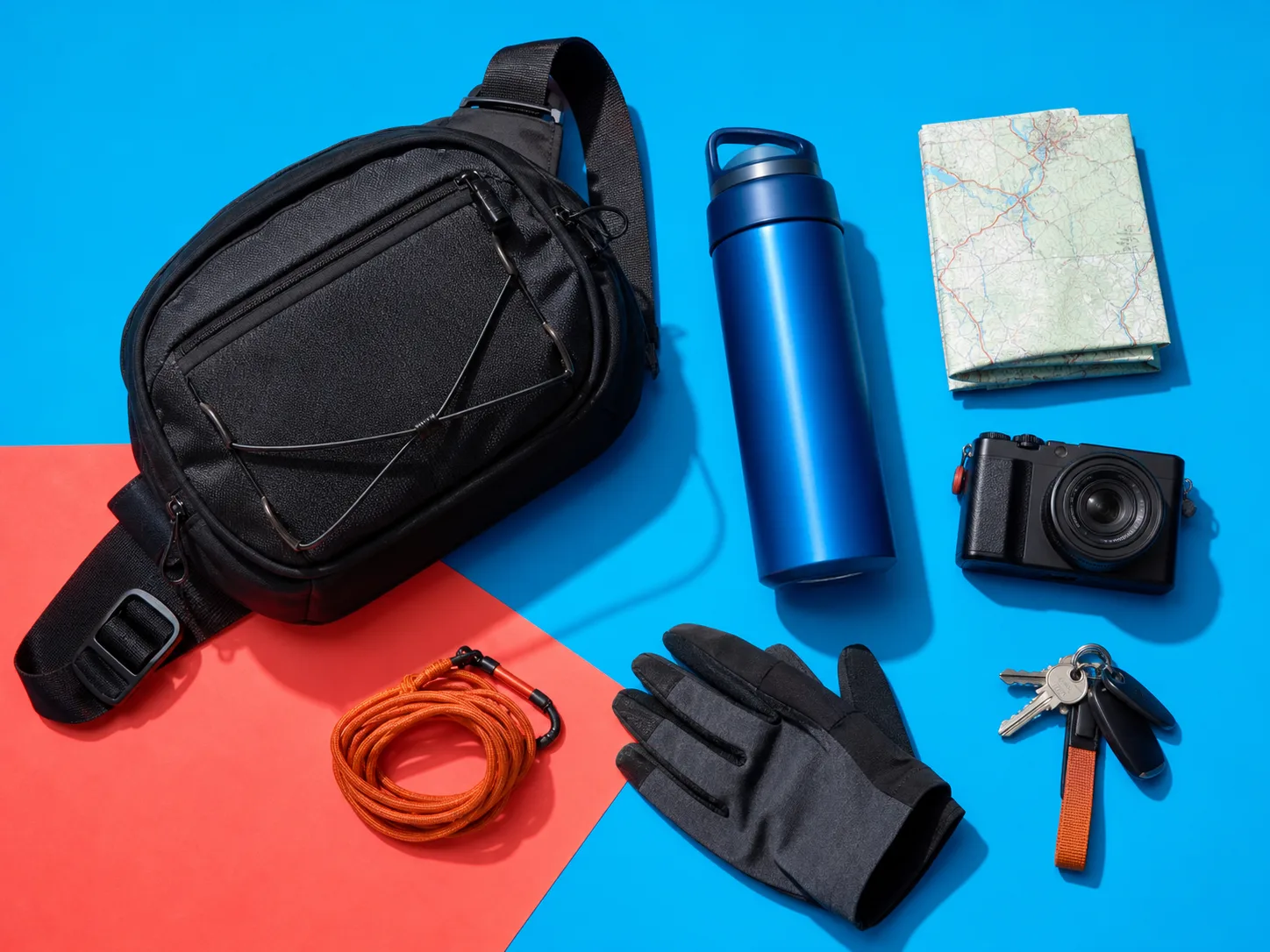 Modular everyday carry arranged on a blue surface